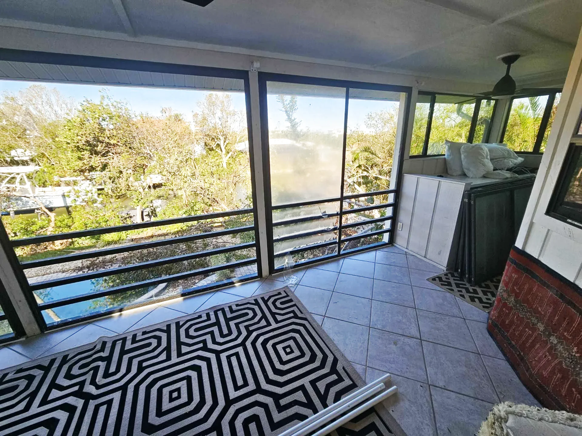 Restored waterfront lanai with canal view
